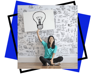 Team Development and Intelligences - Exceler8 - Image of a brunette lady holding a picture above her head of a black hand drawn light bulb
